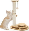 Cute kitten scratching a natural sisal post tower with 3-tier wooden ball track base and hanging plush ball